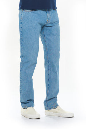 Side profile of the aviator travel jeans in faded indigo
