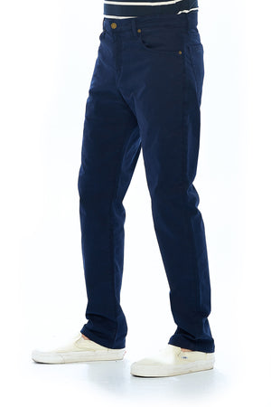 Side profile view of the navy travel pants for men by Aviator made with Japanese twill