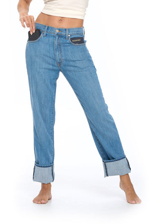 Faded indigo relaxed boyfriend travel pants by Aviator showcasing deep front pockets feature