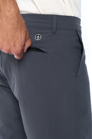 The back hidden zipper pocket on the pickpocket proof travel shorts in grey.