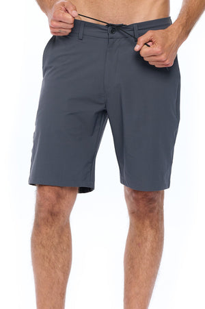 Showing how the Aviator travel shorts have a drawstring and can double as swim shorts.