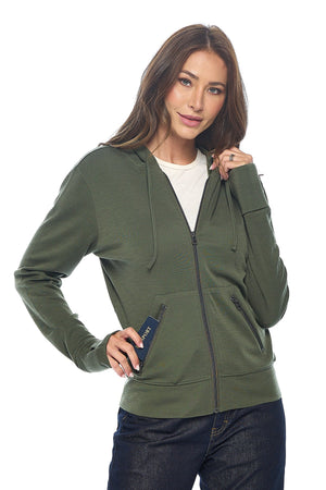 Model wearing the women's merino wool hoodie for travel in olive.