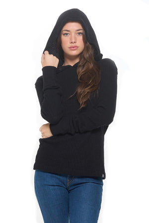 Female model wearing the women's red eye thermal travel hoodie with the hood up.