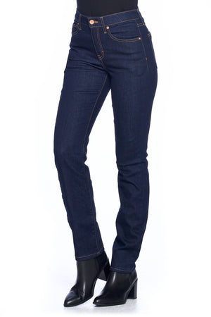 Side profile of dark indigo travel jeans with boots in deadstock