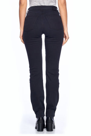 Back view of model wearing slim straight vintage black travel jeans