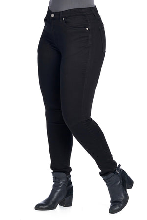 Larger size model side profile of skinny jet black travel jeans