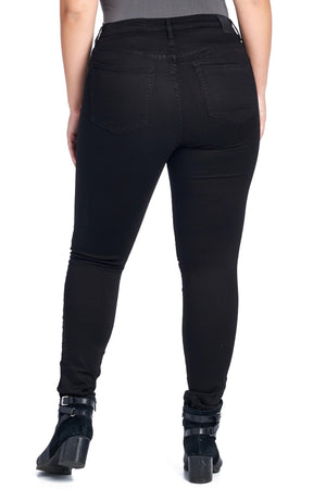 Larger size back view of model wearing skinny jet black travel jeans by Aviator