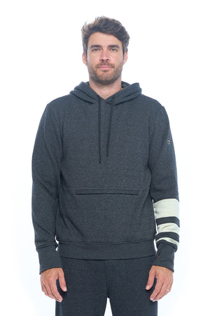Male model wearing the first class lounge travel hoodie by Aviator.