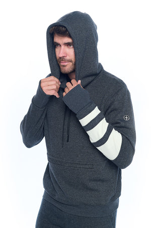 Model wearing the first class lounge travel hoodie by Aviator with the hood up.