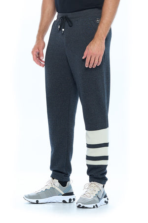 Side profile view of a model wearing the Aviator first class lounge pants.