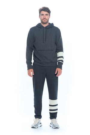 Full view of a model wearing the Aviator first class lounge travel set.