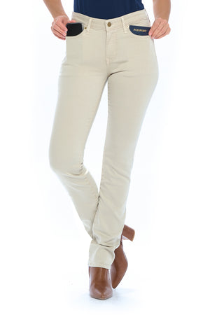 Model posing in the Aviator fly straight sand travel jeans for women.