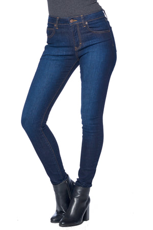 Model posing with vintage Aviator stonewashed indigo travel jeans