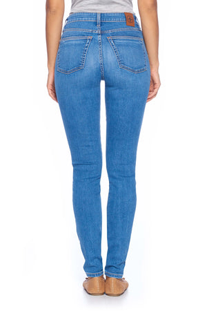 Back view of Aviator women's travel pants in comfort skinny faded indigo