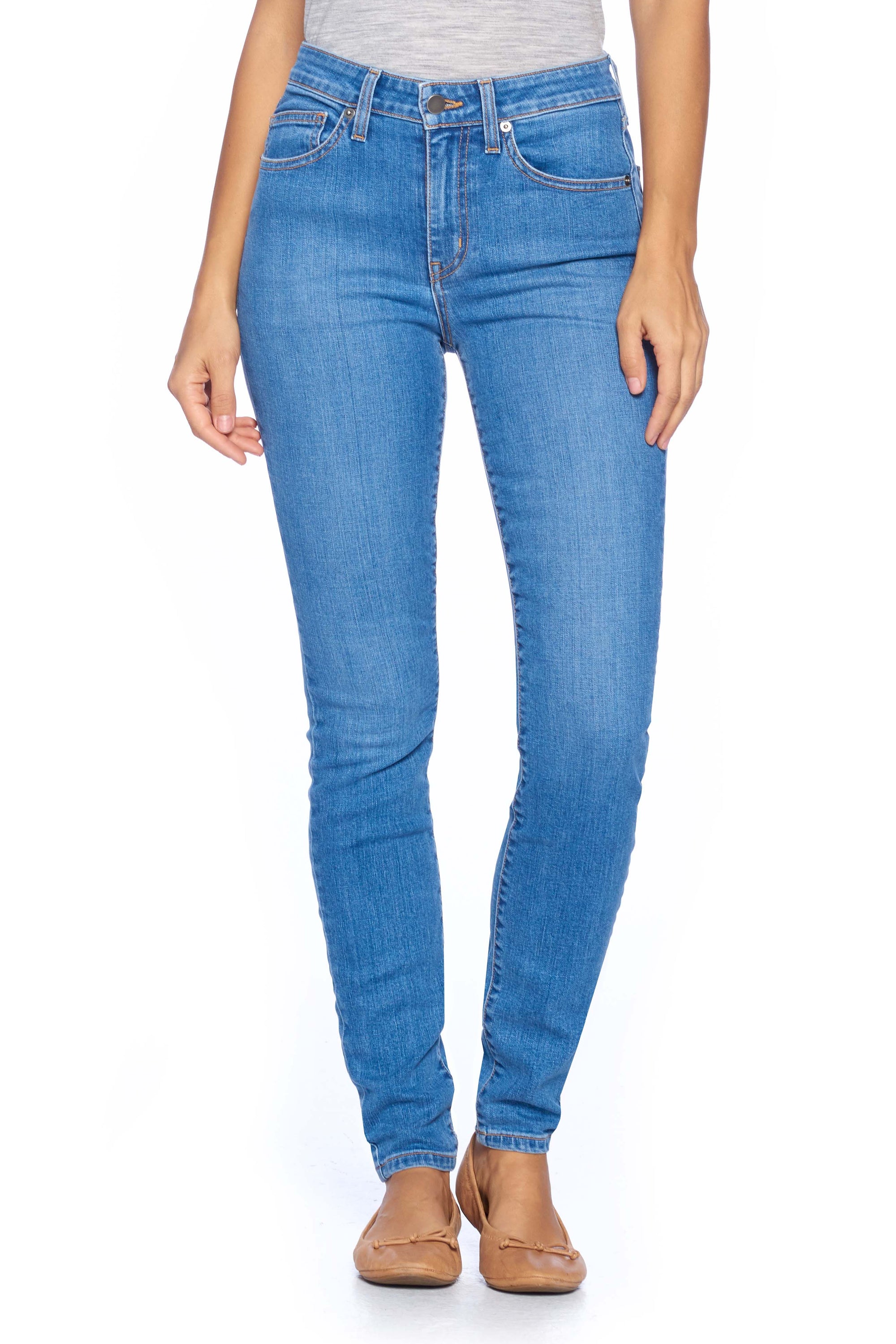 Women's travel jeans in faded indigo comfort skinny style
