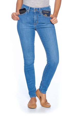 Comfort skinny faded indigo travel jeans showing travel capabilities