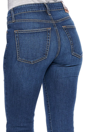 A back side profile view of the fly slim travel jeans for women.