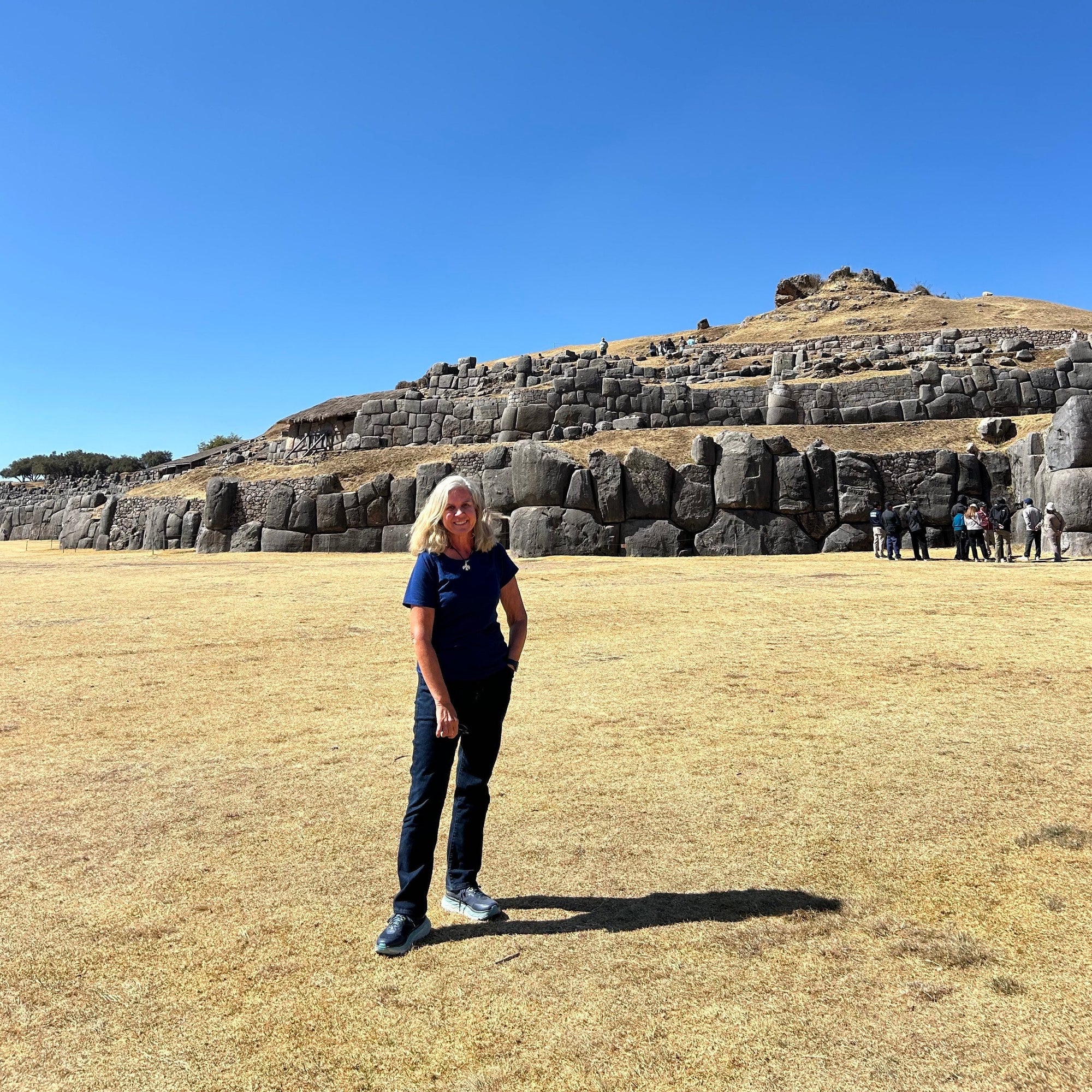 Katrina is pictured in front of the Saqsaywaman ruins in Cusco
