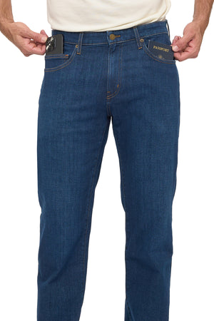Men's vintage indigo travel jeans, front view from waist to shin, phone and passport exposed in the security pockets