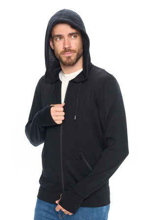 Model wearing first class merino wool travel hoodie with a sleeper hood