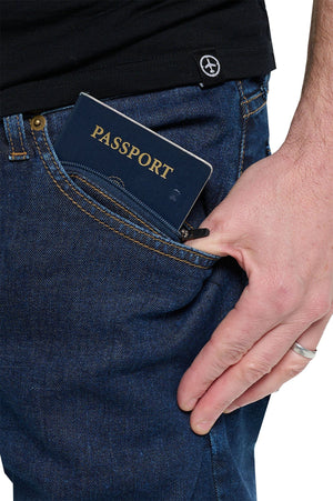 A model using a hidden zipper pocket on the Concorde pickpocket proof pants.