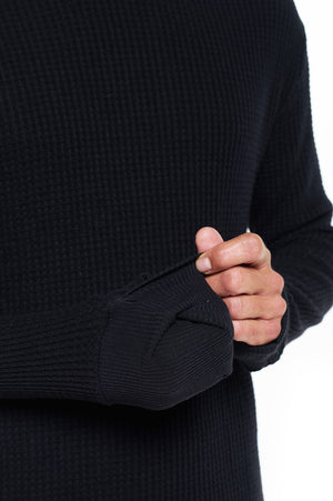 Model showing the three way cuff of the men's red eye thermal travel hoodie.