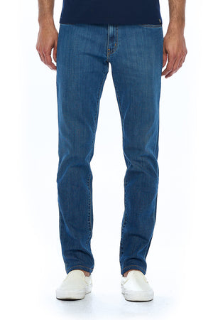Front view of Aviator travel jeans for men in vintage indigo