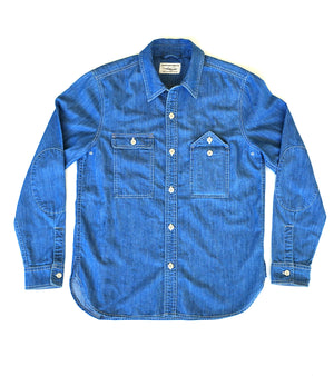 Stilllife of blue chambray shirt on a white background