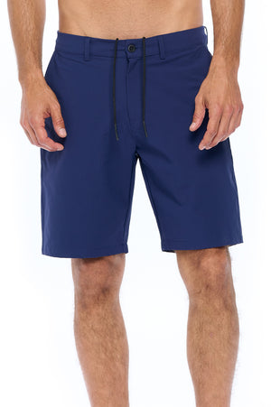 Model wearing the non stop travel shorts 3.0 as swim trunks.