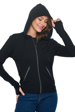 Model wearing the merino wool travel hoodie for women in black