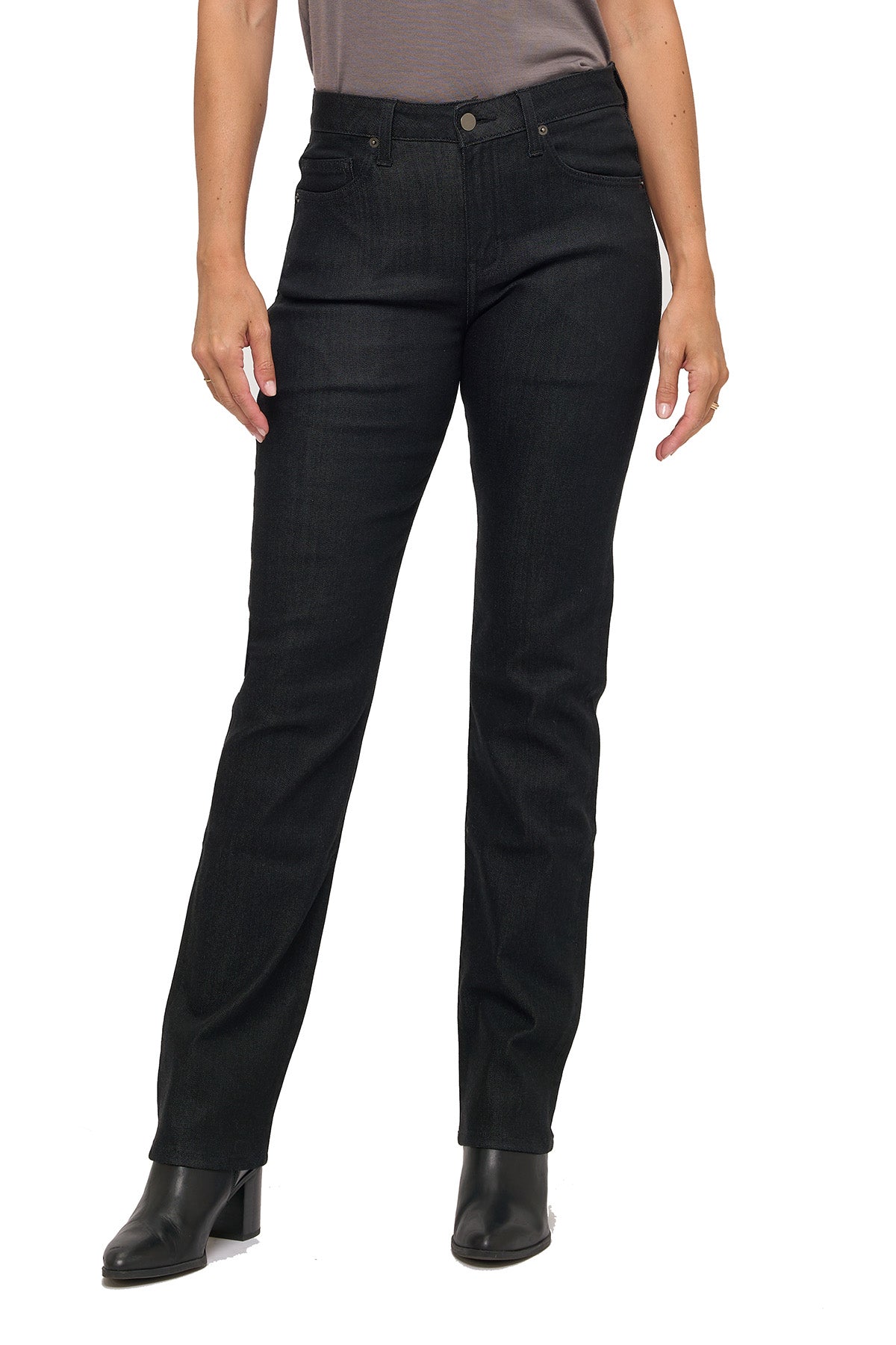 Model wearing black jeans on a white background