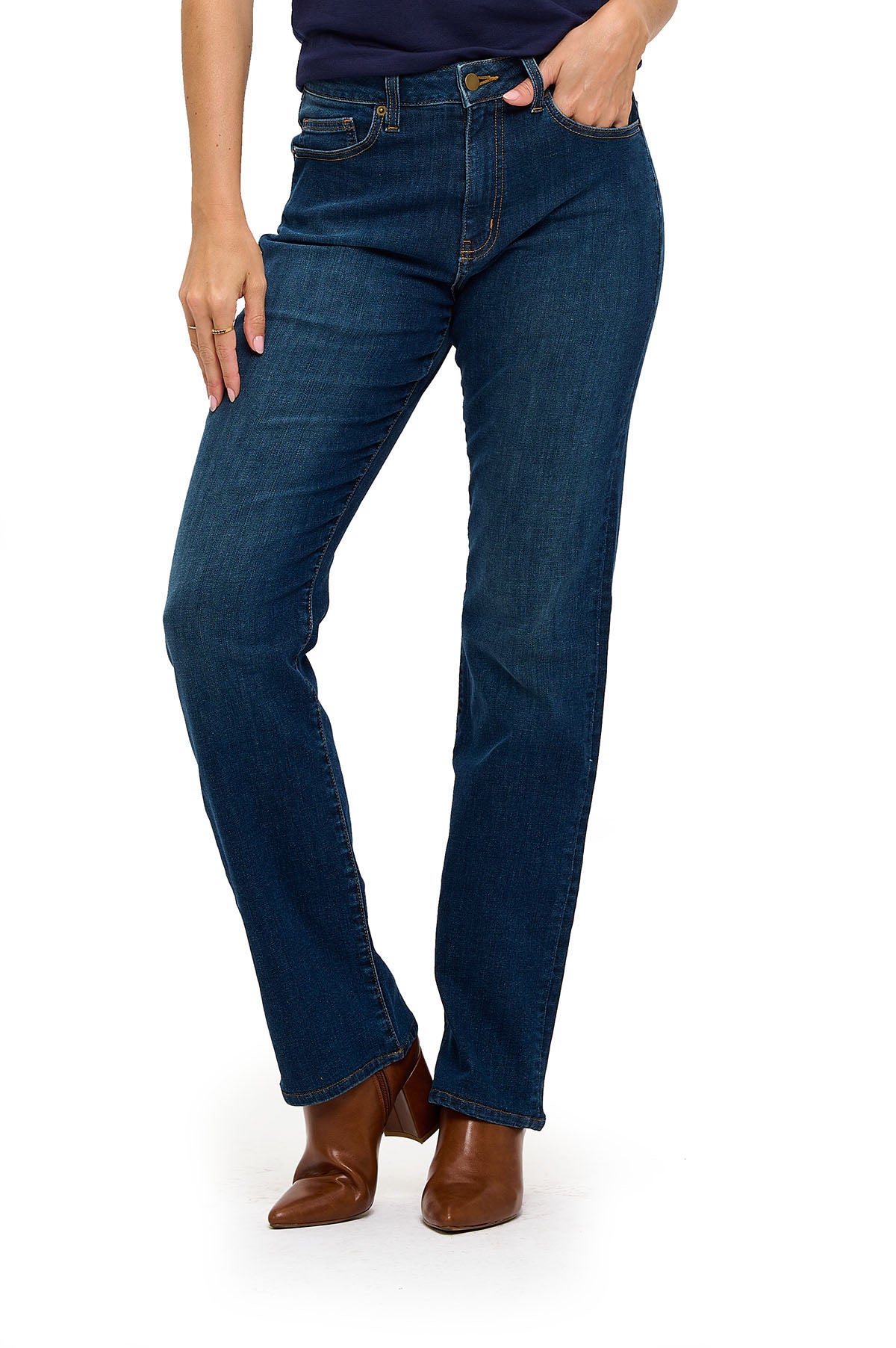 A pair of mid-waisted, straight-leg blue jeans with deep front pockets. The jeans are styled with brown boots.